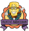 Cartoon mascot with glasses, big smile, and open arms stands in front of a laurel wreath and orange badge. Below, a purple ribbon reads CREATIVE AMBASSADOR in bold letters.
